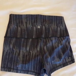 Lululemon black and silver metallic shorts, size 2, never worn.